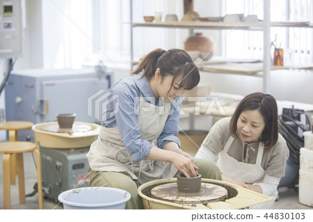 A woman doing ceramics A woman doing ceramics 44830103