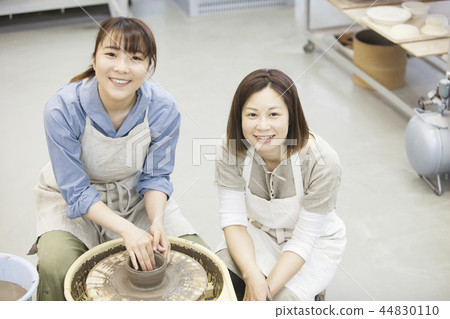 A woman doing ceramics A woman doing ceramics 44830110