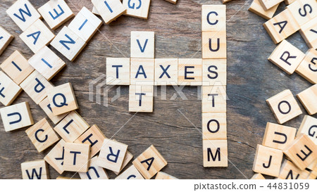 Taxes print text on wood square block Taxes print text on wood square block 44831059