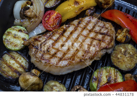 Cooking steak and mushrooms on the grill pan Cooking steak and mushrooms on the grill pan 44831178