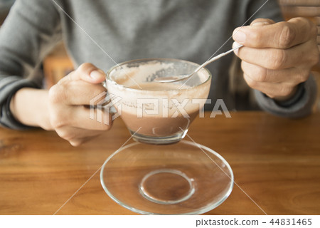 hands holding hot cup of coffee or tea hands holding hot cup of coffee or tea 44831465
