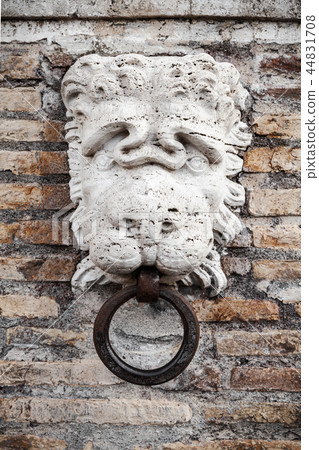 Stone lion head with ring, Rome 44831708