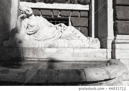 Street fountain with sleeping girl statue Street fountain with sleeping girl statue 44831712