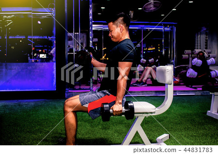 Asian man Bodybuilder with dumbbell weights Asian man Bodybuilder with dumbbell weights 44831783