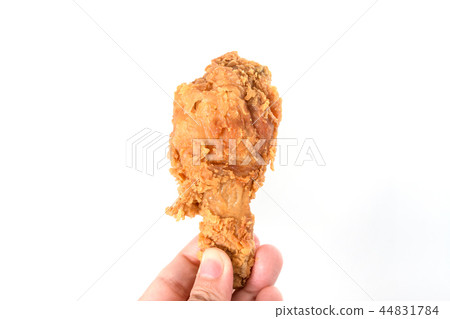 Hand hold fried chicken isolated on white Hand hold fried chicken isolated on white 44831784