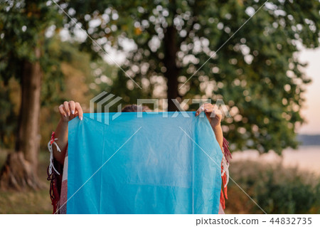 Blue sky lattern in the female hands outdoors 44832735