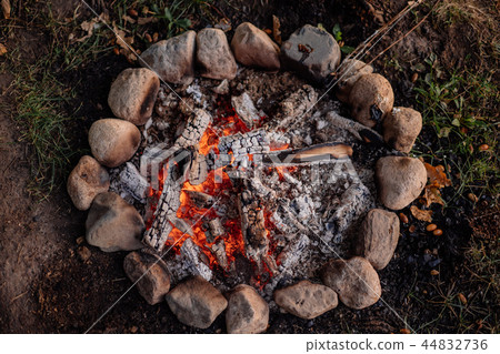 Bonfire with woods and stones around on hiking Bonfire with woods and stones around on hiking 44832736