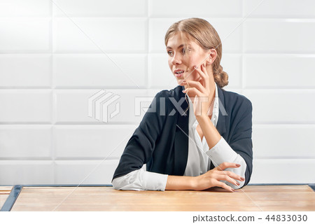 Front view of attractive woman looking aside and posing with new manicure. 44833030