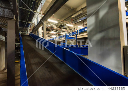 Baggage claim area with empty baggage carousels 44833165