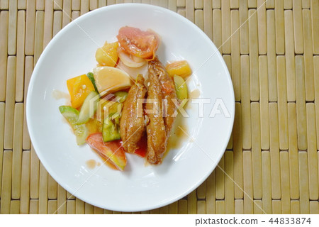 deep fried fish in sweet and sour gravy sauce deep fried fish in sweet and sour gravy sauce 44833874