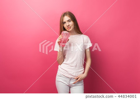 Portrait of beautiful young woman drinking Portrait of beautiful young woman drinking 44834001