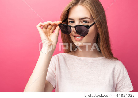Beautiful young blonde girl in glasses  44834023