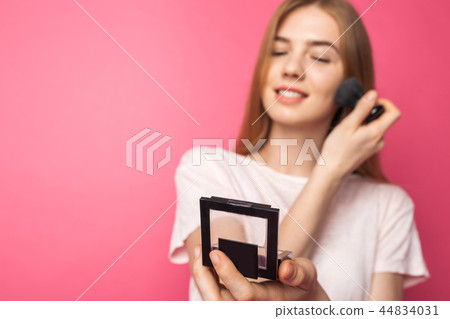 Young beautiful woman enjoys brush  44834031