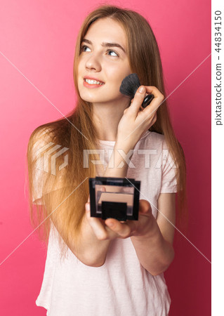 Young beautiful woman enjoys brush Young beautiful woman enjoys brush 44834150