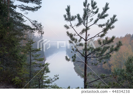 Autumn landscape and red stone cliff of Gauja river, Latvia, Europe. Autumn landscape and red stone cliff of Gauja river, Latvia, Europe. 44834238