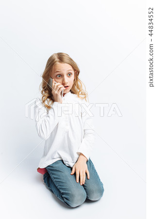 Beautiful teen girl talking on mobile phone Beautiful teen girl talking on mobile phone 44834552