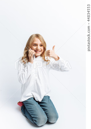 Beautiful teen girl talking on mobile phone 44834553