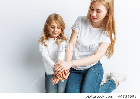 Mom and little daughter looking at each other 44834695