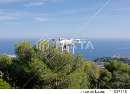 Drone, flying against the blue sky quadrocopter fpv fly camera rc controller 44837858