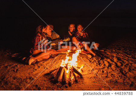 young friends have picnic with bonfire on the beach young friends have picnic with bonfire on the beach 44839788