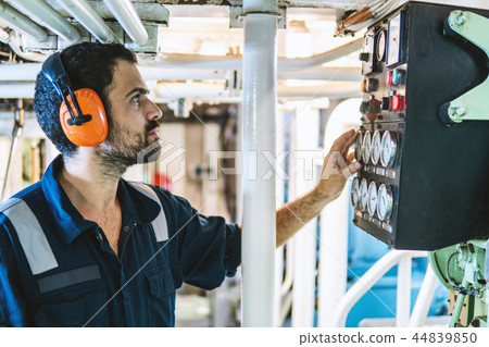 Marine engineer officer working in engine room 44839850