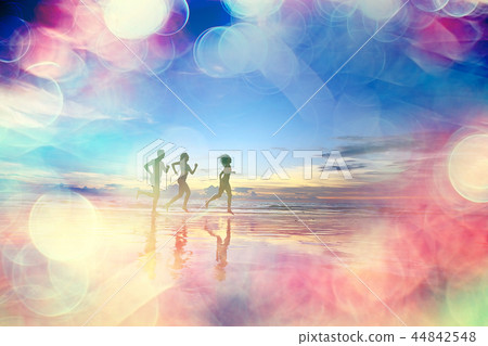 silhouettes of athletes running along the beach / sports summer in the warm sea, healthy rest, sports activity, summer vacation 44842548