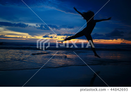girl is having fun and jumping on beach freedom / concept freedom and summer beach, sporty graceful girl is jumping and having fun beach 44842693