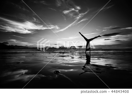 girl is having fun and jumping on beach freedom / concept freedom and summer beach, sporty graceful girl is jumping and having fun beach girl is having fun and jumping on beach freedom / concept freedom and summer beach, sporty graceful girl is jumping and having fun beach 44843408