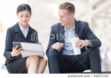 Businessman Discussing With Beautiful Partner. Businessman Discussing With Beautiful Partner. 44845100