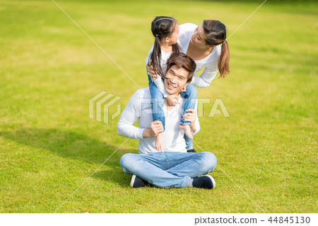 Asian girl on neck parents big happy laughing. 44845130