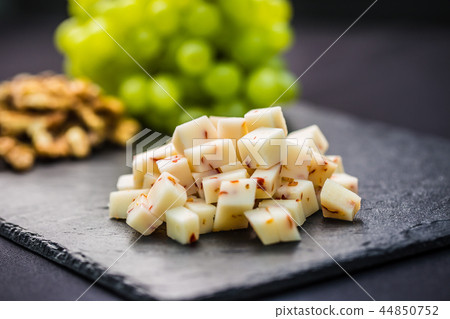 Cheese pieces juicy grapes and walnuts Cheese pieces juicy grapes and walnuts 44850752