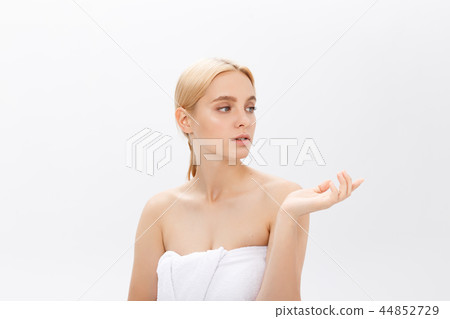 Young woman with beauty skin and beauty hairstyle over gray background 44852729