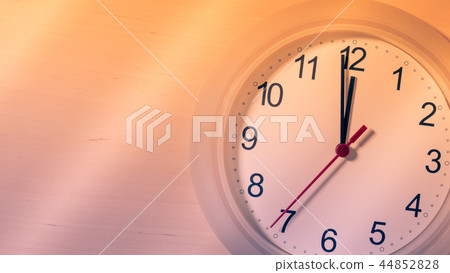 Clock ticking showing twelve hours Clock ticking showing twelve hours 44852828