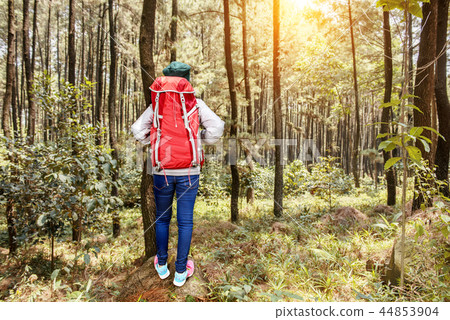 Asian woman with backpack standing look around 44853904