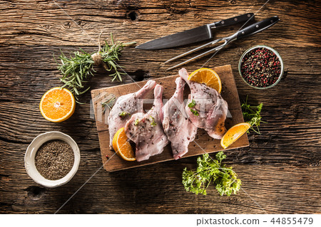 Top of view raw duck legs with oranges and herbs. Top of view raw duck legs with oranges and herbs. 44855479