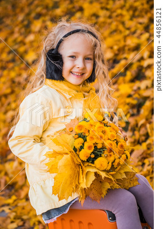 Little beautiful girl with blond hair in autumn background Little beautiful girl with blond hair in autumn background 44856121