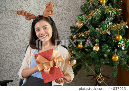 Businesswoman with present Businesswoman with present 44857913