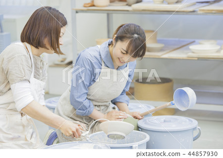 A woman doing ceramics 44857930