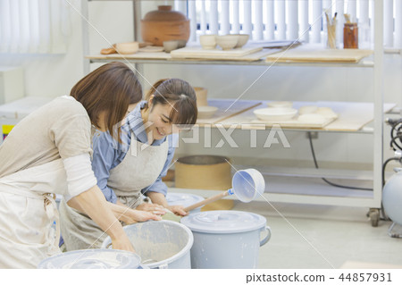 A woman doing ceramics A woman doing ceramics 44857931