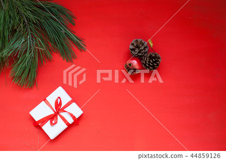Christmas tree needles gift bumps on a red Christmas background Christmas Christmas tree needles gift bumps on a red Christmas background Christmas 44859126