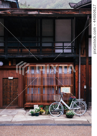 Old bicycle on raining day and Old wooden house 44860627