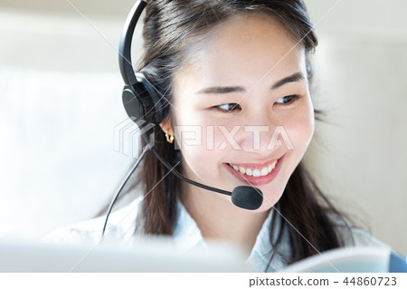 Woman doing a chat with a headset 44860723