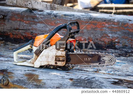 Orange gasoline engine portable chainsaw Orange gasoline engine portable chainsaw 44860912