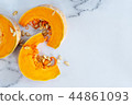 sliced raw pumpkin on marblel table background. 44861093