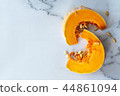 sliced raw pumpkin on marblel table background. 44861094