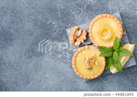 Homemade lemon curd in tartlets with fresh lemon  44861895