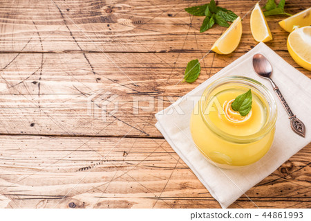 Homemade lemon curd in glass jars with fresh lemon 44861993