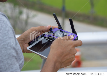 man control drone from remote controller man control drone from remote controller 44863418