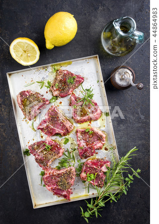 Raw T-Bone Lamb Steak with Seasonings as top view Raw T-Bone Lamb Steak with Seasonings as top view 44864983