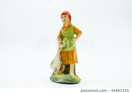Christian nativity scene figure. Woman with a duck Christian nativity scene figure. Woman with a duck 44865350